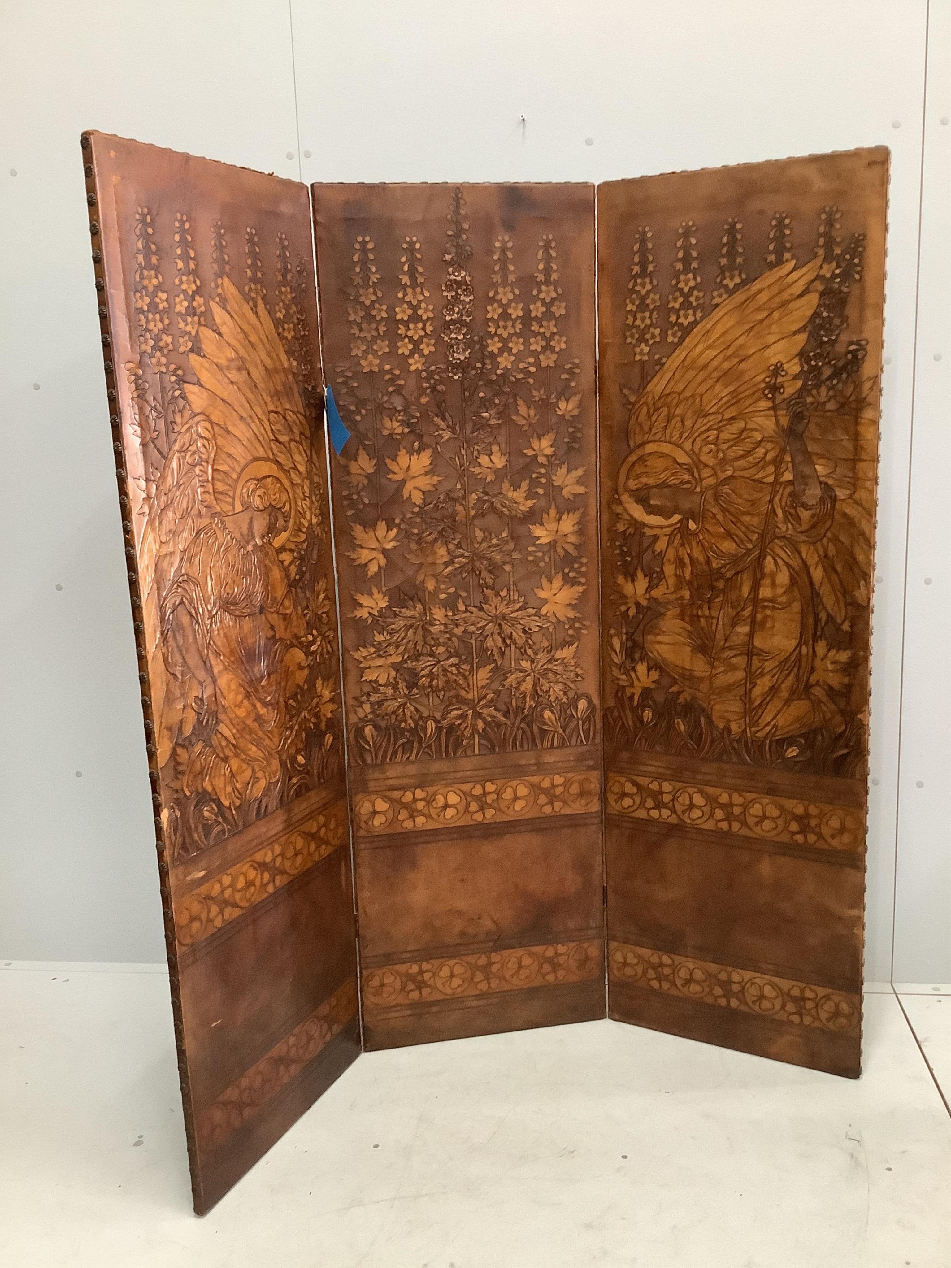 An embossed leather three fold dressing screen, each panel width 50cm, height 166cm. Condition - fair